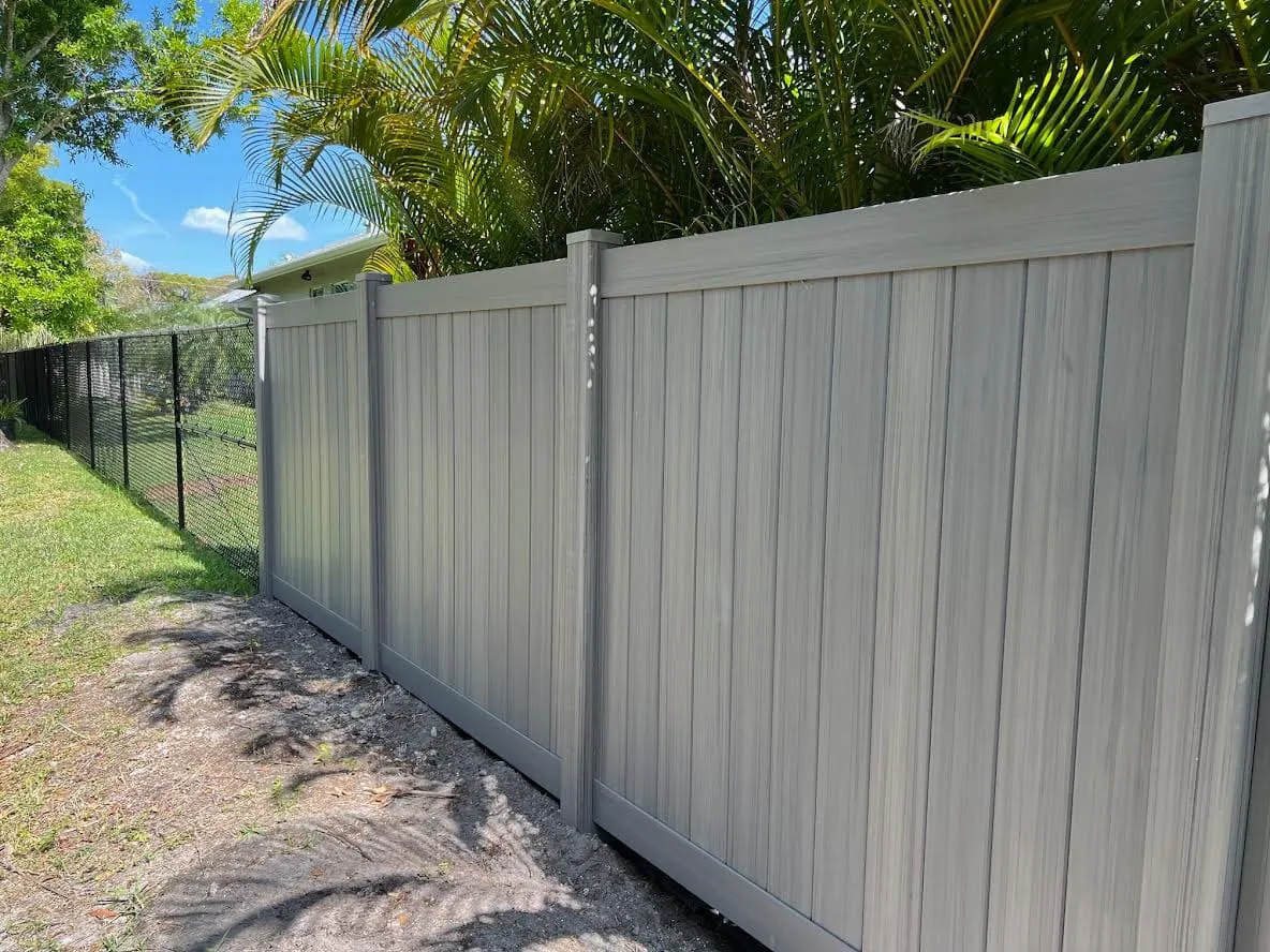 Wooden privacy fence under blue sky