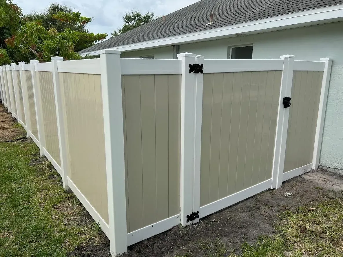 Vinyl privacy fence around backyard.
