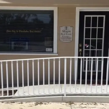 Real estate office entrance with ramp