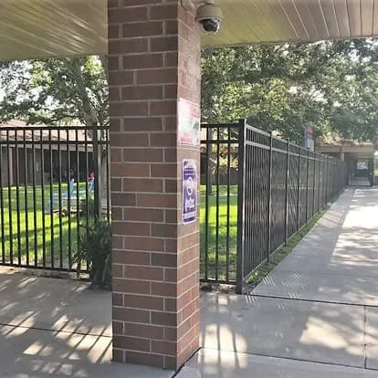 Security camera on brick column