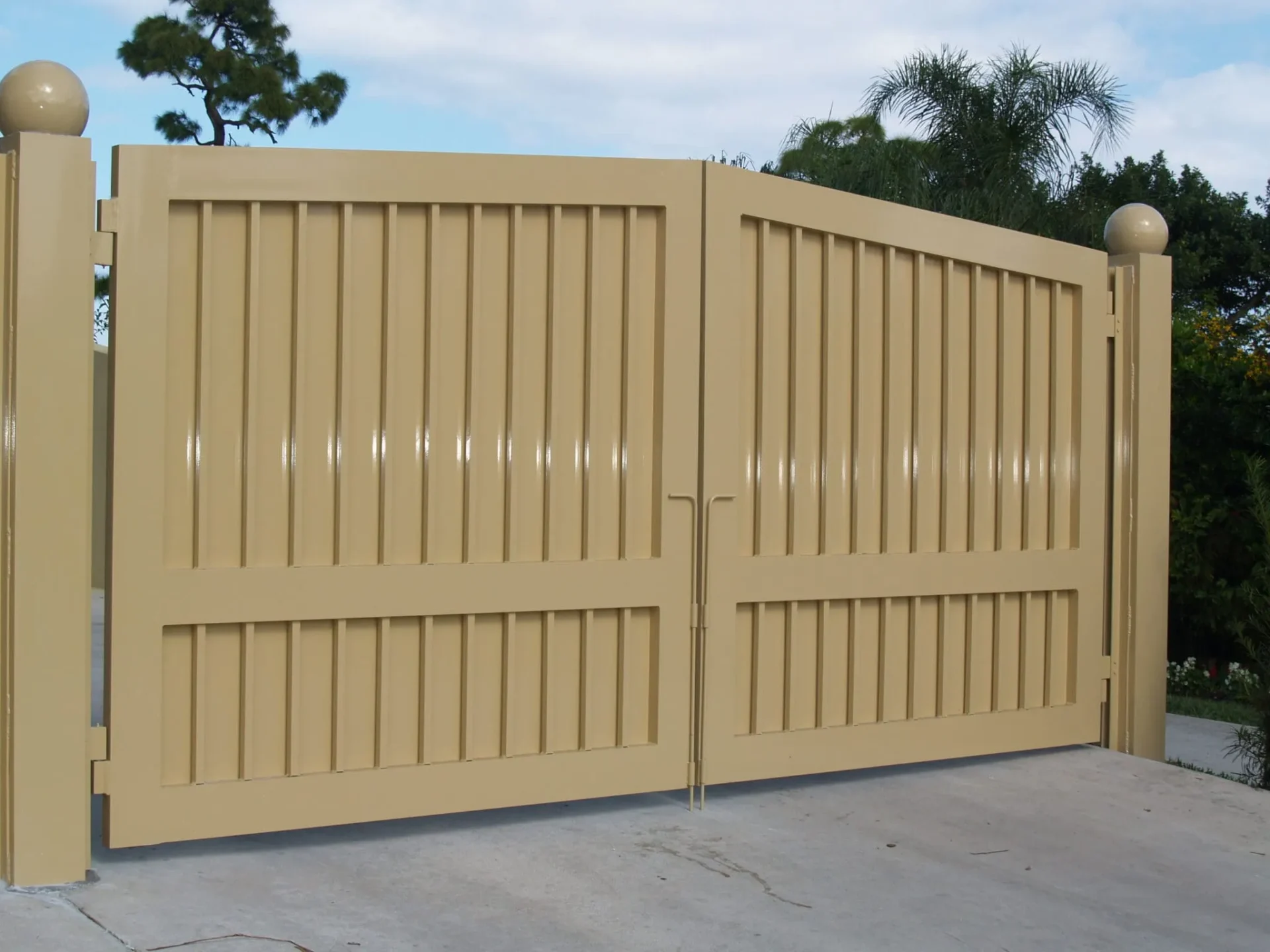 Large tan gate with vertical panels
