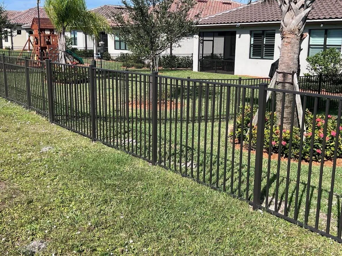 Garden enclosed by metal fence