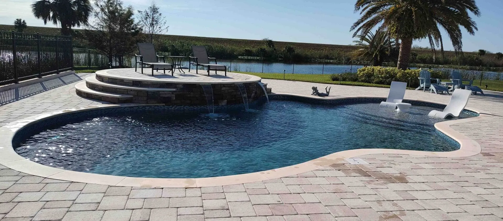 Serene poolside with palm trees