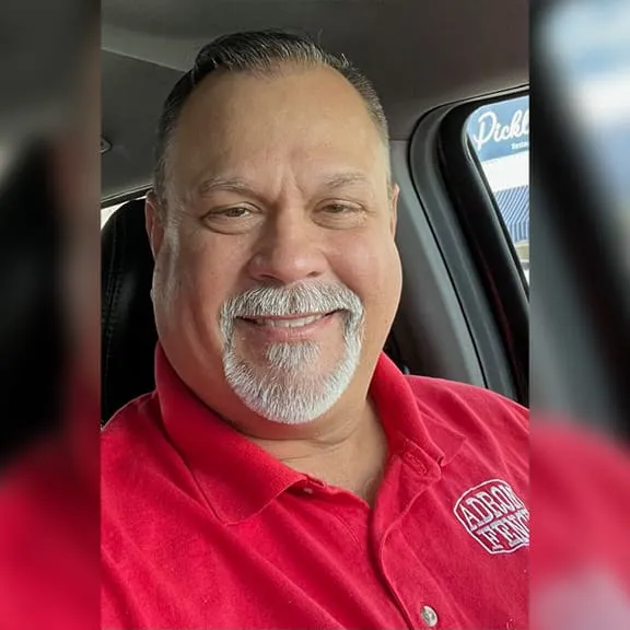Happy man sitting in vehicle
